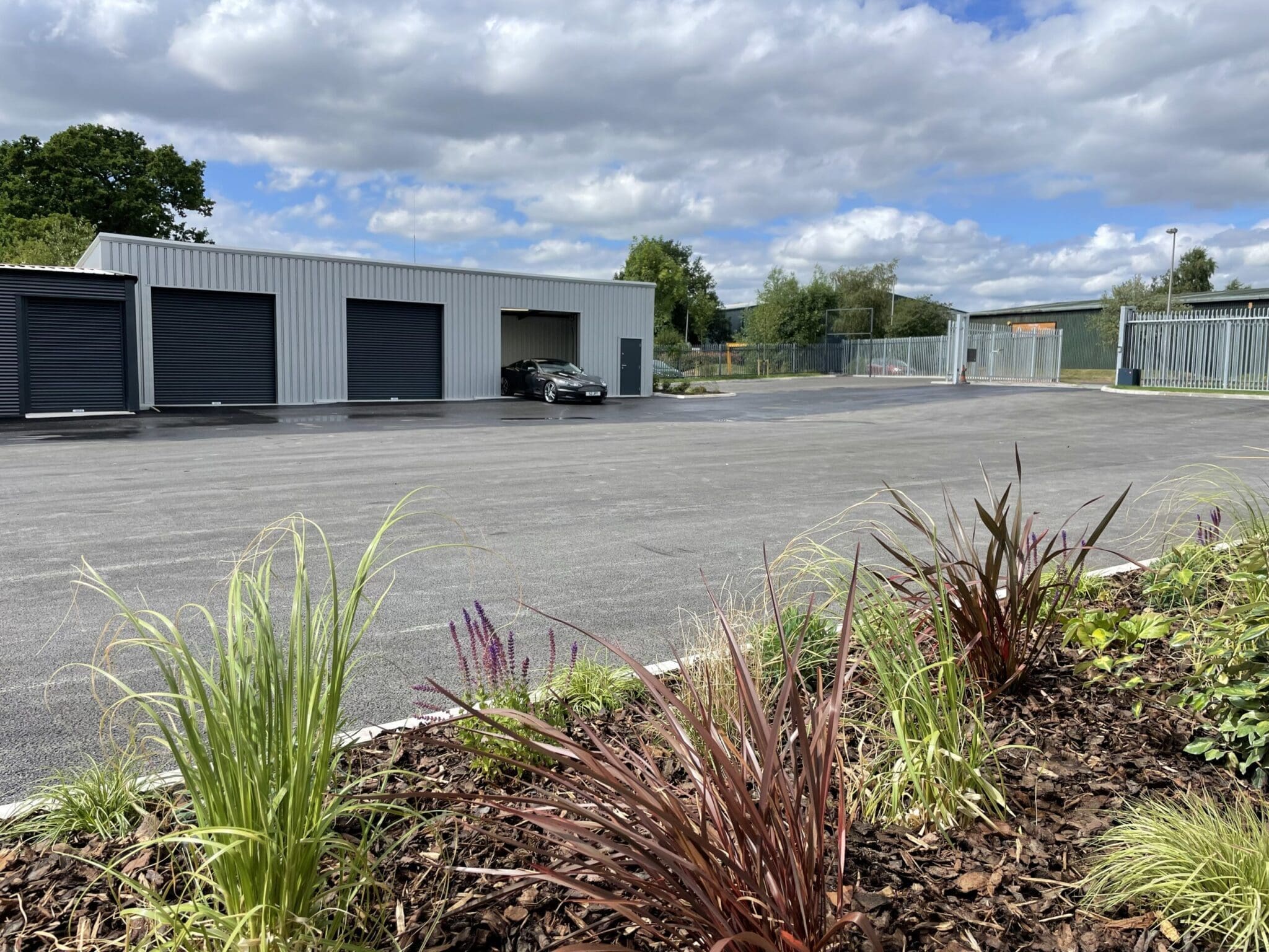 a storage facility with black roller shutters.